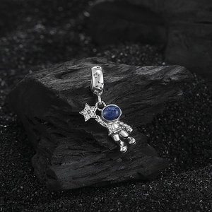 925 silver astronaut pendant with blue gemstone and star detail on lunar rock base