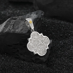 S925 sterling silver four-leaf clover pendant with floral engravings and gold accent