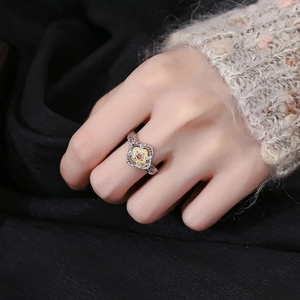 Elegant S925 silver petal ring with hollow retro design and red zircon stone for women