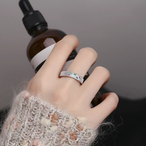 S925 sterling silver ring with colorful zircons and brushed texture on woman's finger