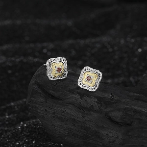 Elegant S925 silver four-leaf clover earrings with red zircon in a vintage filigree design