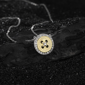 Elegant s925 silver button pendant necklace with gold accents and sparkling crystals