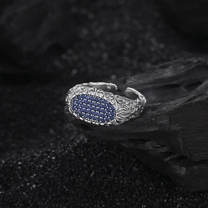Vintage s925 silver ring featuring blue pavé gems and intricate embossed textures