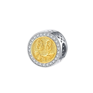 Macro detail of S925 silver smiley charm with gold plating and white zircon inlay