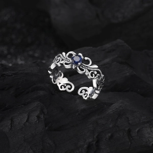 Vintage s925 silver open ring featuring blue gemstone and intricate filigree carvings