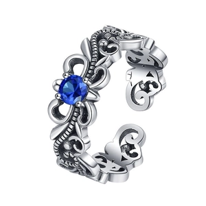 Vintage S925 silver open ring featuring an intricate hollow pattern and blue zircon center