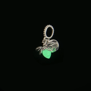 Macro detail of silver firefly pendant featuring the engraved text You light my life