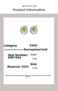 Detail of s925 silver crescent stud earring with gold texture and emerald stone