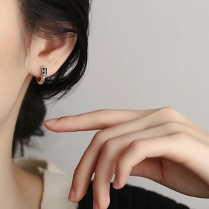 S925 sterling silver earrings with green zircon and crater texture in retro style