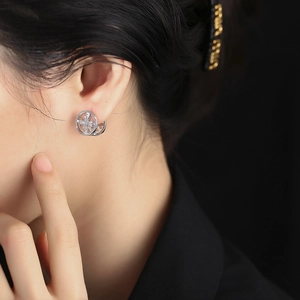 S925 sterling silver cross hoop earrings with cubic zirconia on female model
