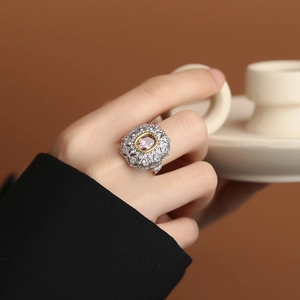 Vintage S925 silver ring featuring pink sapphire with gold-edged filigree detailing