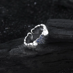 S925 sterling silver ring with interconnected hearts and blue zircon pavé details