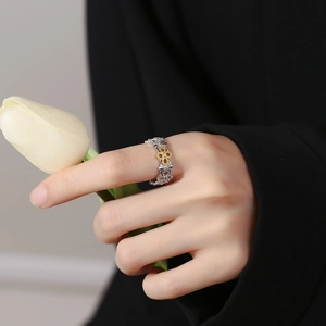 Vintage S925 silver camellia open ring with gold floral detail on female model's finger