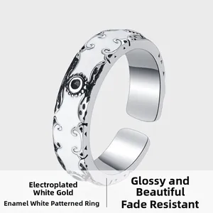 Detail of s925 silver ring with white enamel inlay and vintage filigree engraving