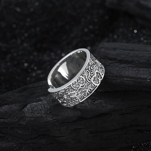 Vintage S925 sterling silver floral band ring with micro-set zircon on dark coal background