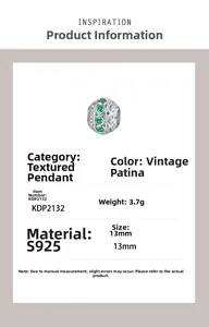 Detail of S925 silver retro scroll charm with green zircon stones and 13mm diameter