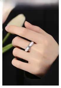 Detail of s925 silver wide ring with white enamel and vintage floral pattern
