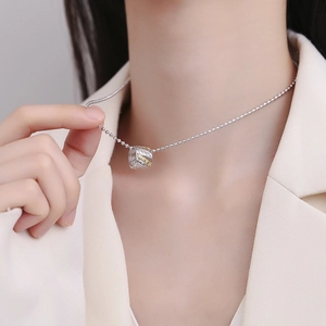 Elegant S925 silver leaf pendant with micro-diamonds on model in white suit