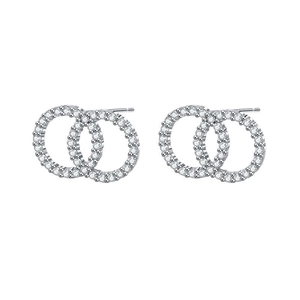 Detail of s925 silver interlocking circle stud earrings with zircon stones setting