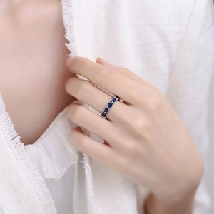 S925 sterling silver angel ring with blue enamel and cross pattern on female finger