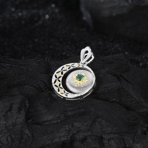 S925 silver crescent pendant with hollow flower design and green gemstone inlay