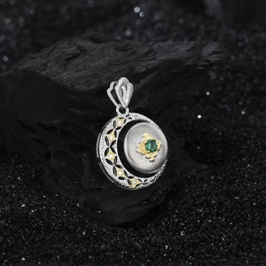 S925 silver crescent openwork pendant with green gemstone and gold brushed texture details