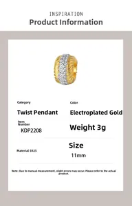 Macro shot of S925 sterling silver twisted pendant with gold finish and cubic zirconia