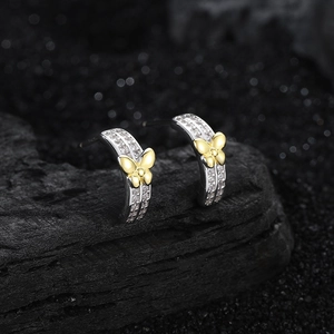 Elegant S925 silver curved stud earrings with double-row zircon and gold butterfly accent