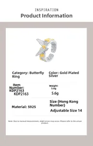 Macro detail of S925 silver butterfly ring with golden accents and floral engravings