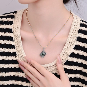Vintage S925 silver butterfly relief pendant with green zircon on bicolor beaded chain