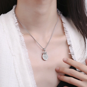 S925 sterling silver mermaid crown medal pendant necklace on female model neck