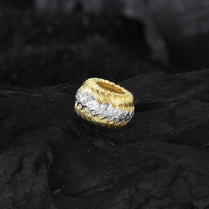 S925 sterling silver cylinder pendant featuring gold spiral texture and pavé set cubic zirconia