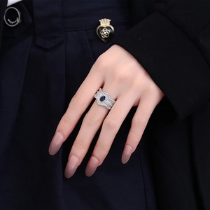 Vintage S925 silver ring with blue oval sapphire and pavé diamonds in wavy lace design