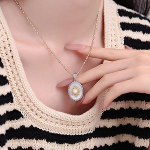 Elegant s925 silver oval mother-of-pearl pendant with pearl inlay on a two-tone chain