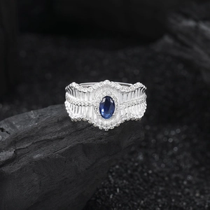 S925 silver retro ring with blue sapphire and diamonds on black stone background