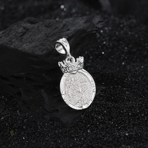 S925 sterling silver mermaid relief pendant with crown detail on charcoal background