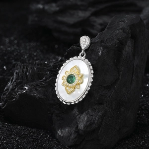 S925 silver oval pendant with white mother of pearl, gold flower, and green gemstone