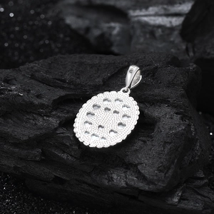 Detail of S925 sterling silver oval pendant featuring a hollow heart pattern on the back