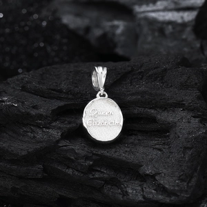 Macro shot of S925 sterling silver oval pendant with Queen Elizabeth relief and matte texture
