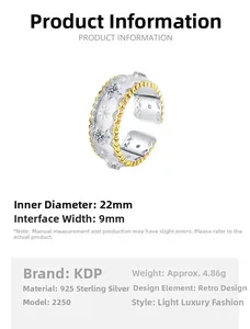 Detail of S925 silver ring with star pattern, zircon inlay and gold wavy edges