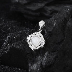 Vintage s925 silver pendant featuring white agate with intricate lace floral carvings