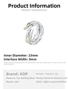 Detail view of S925 silver feather ring with 23mm inner diameter and gold accents