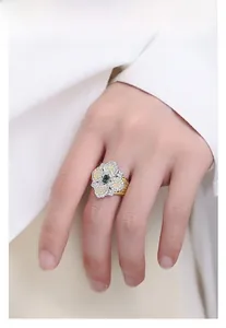 Close-up of S925 silver honeycomb snowflake ring with emerald cut green gemstone