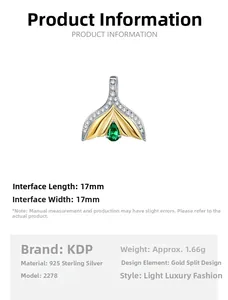 Detail of S925 silver mermaid tail pendant with emerald zircon and two-tone gold plating