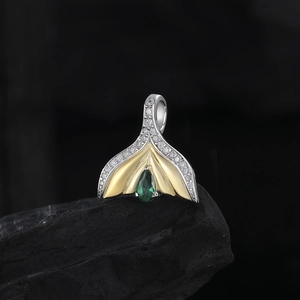 S925 silver mermaid tail pendant with emerald zircon on a natural black stone base