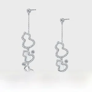Close-up of S925 silver hulu drop earrings with white mother of pearl and pavé crystals
