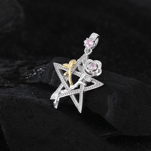 S925 Silver star pendant with rose and pink zircon on a dark textured background