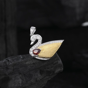 S925 sterling silver swan pendant with golden brushed wings and red gemstone