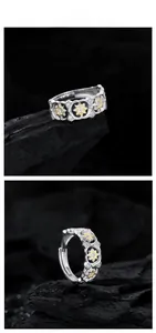 Detail view of S925 sterling silver star ring with gold accents and zircon stones