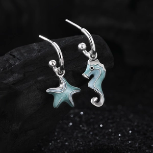 Asymmetric S925 silver seahorse and starfish earrings with light blue enamel finish